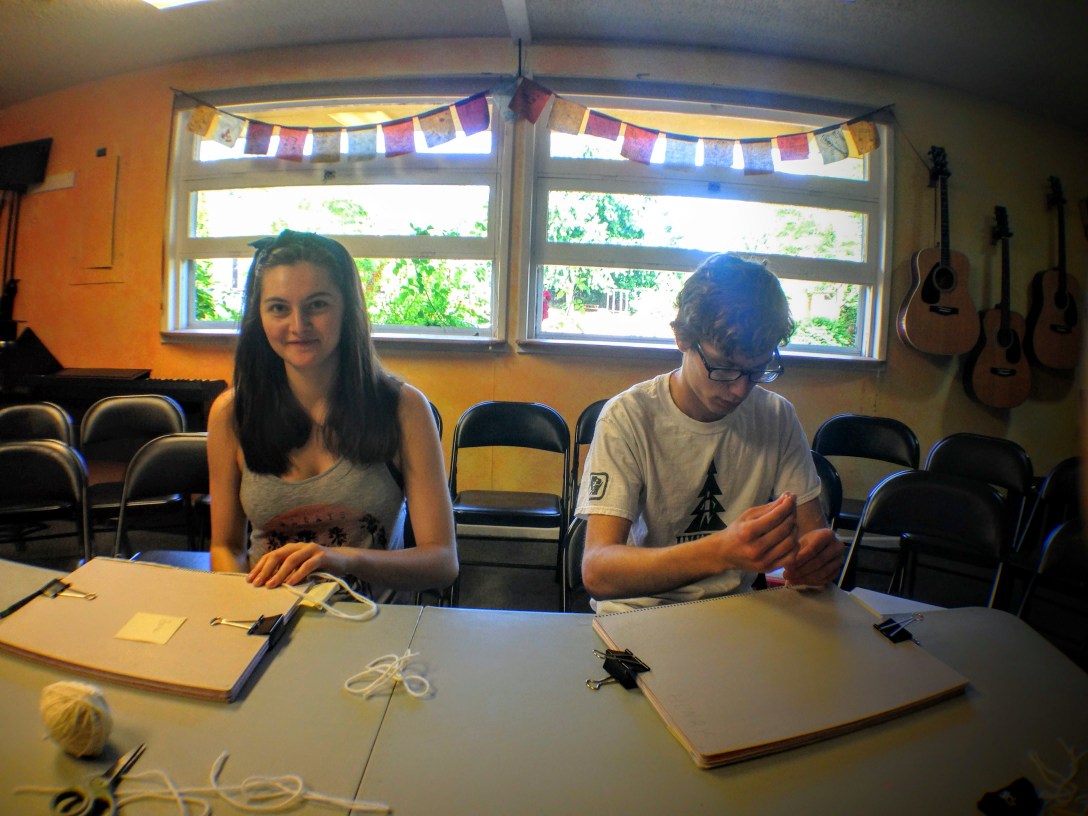 book binding with Maddy and Caleb